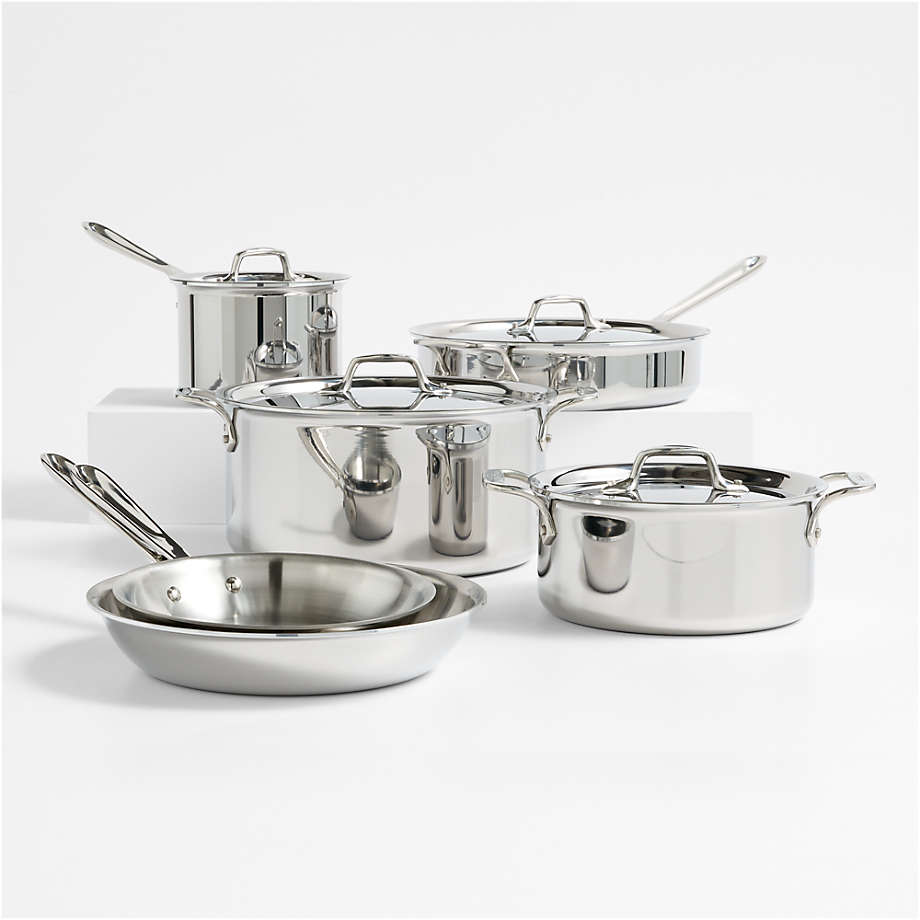 Set of stainless steel cookware on a white background