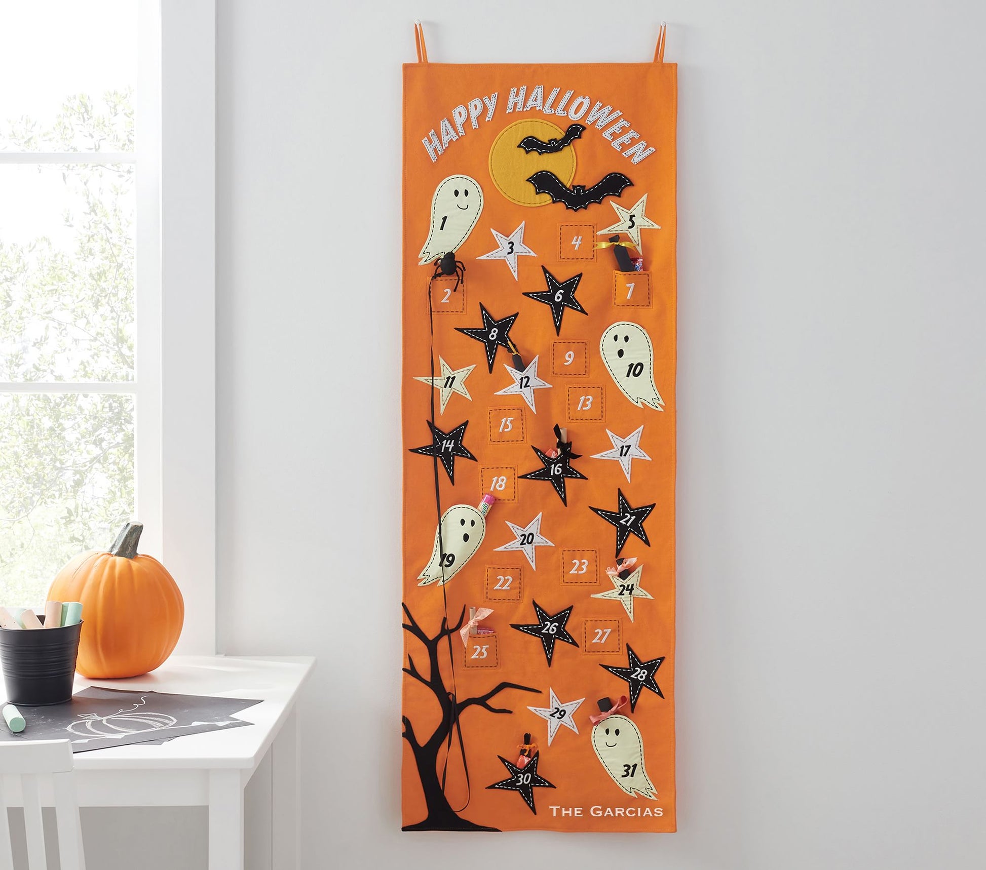 Happy Halloween Ghostly Countdown Calendar in orange with white ghost figures and black & white stars